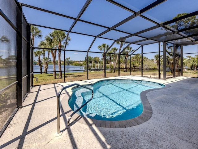 pool featuring a water view, a lanai, and a patio