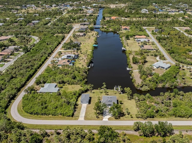drone / aerial view with a water view and a residential view