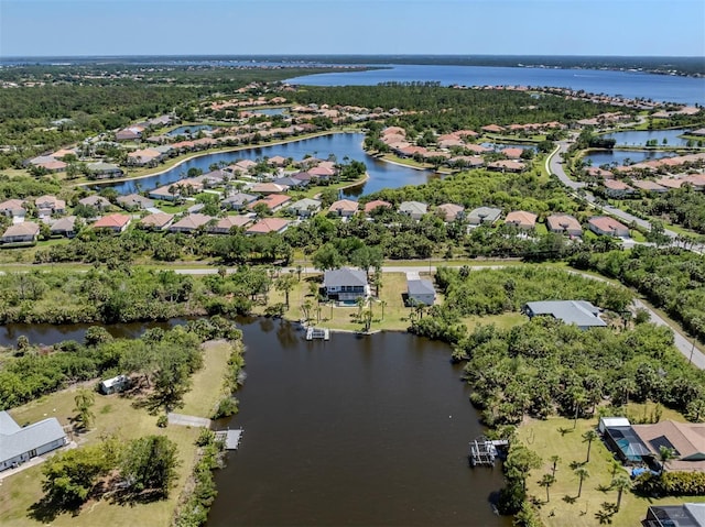 aerial view featuring a water view and a residential view