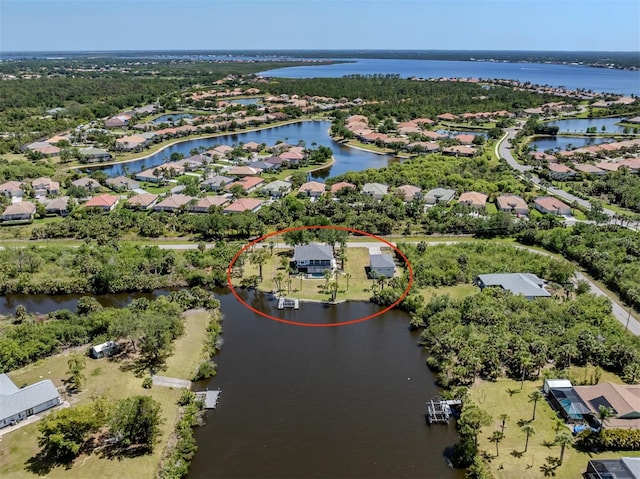aerial view featuring a water view and a residential view
