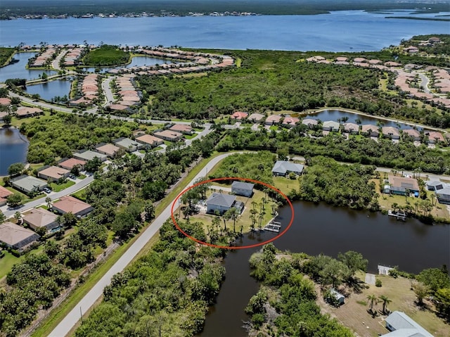 aerial view featuring a water view and a residential view