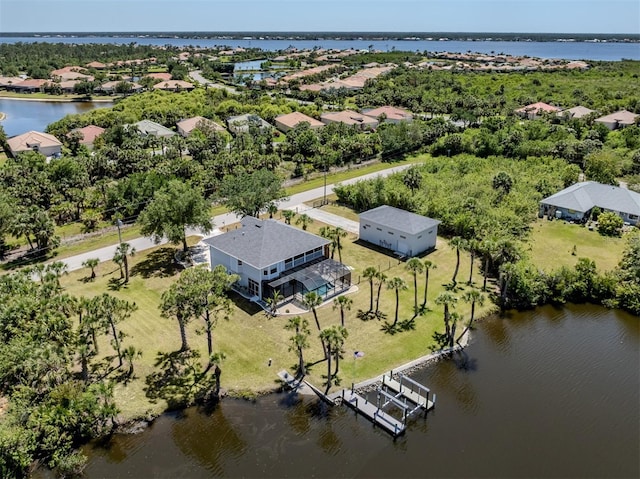 aerial view with a water view and a residential view