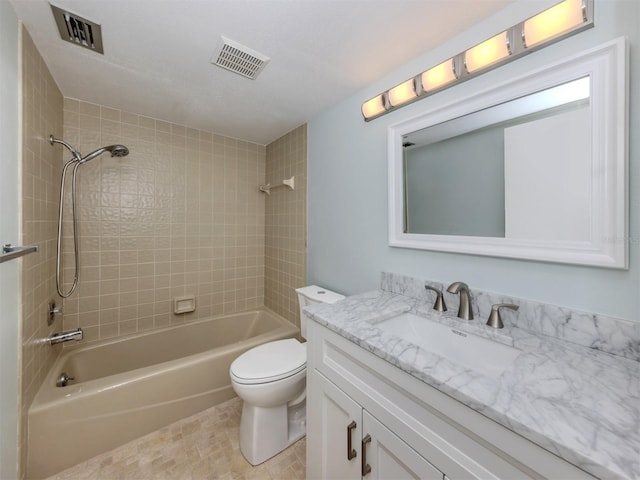 bathroom with vanity, toilet, and bathtub / shower combination