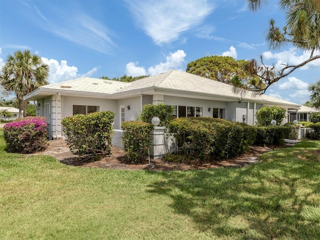 232 Cerromar Way Unit 38, Venice, FL 34293 - view of side of property with a lawn and stucco siding
