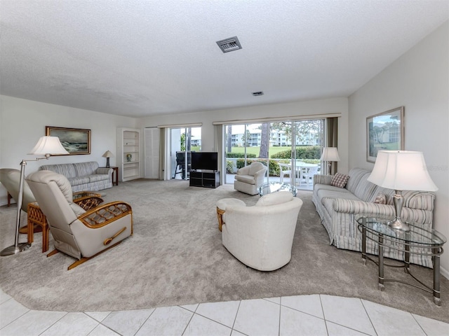 232 Cerromar Way Unit 38, Venice, FL 34293 - living room featuring carpet flooring and a textured ceiling