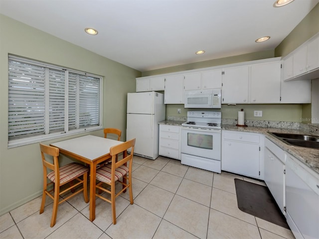 232 Cerromar Way Unit 38, Venice, FL 34293 - kitchen featuring white appliances, a sink, white cabinets, light tile patterned floors, and recessed lighting