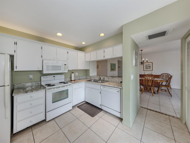 232 Cerromar Way Unit 38, Venice, FL 34293 - kitchen featuring white appliances, a sink, light tile patterned flooring, white cabinets, and recessed lighting