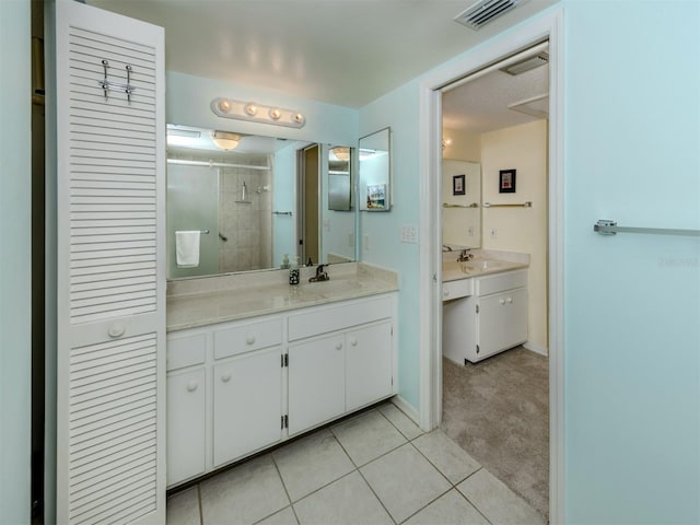 232 Cerromar Way Unit 38, Venice, FL 34293 - bathroom with a shower stall, tile patterned flooring, and vanity