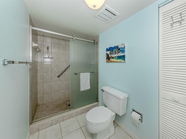 232 Cerromar Way Unit 38, Venice, FL 34293 - bathroom with toilet, a shower stall, tile patterned floors, and baseboards