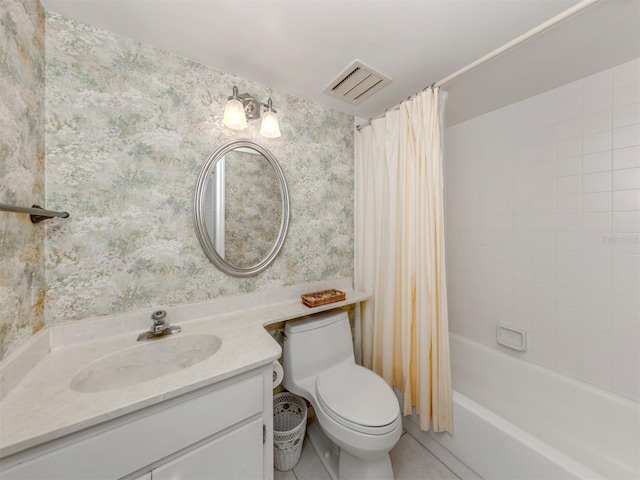 232 Cerromar Way Unit 38, Venice, FL 34293 - full bath with wallpapered walls, toilet, shower / bath combo with shower curtain, vanity, and tile patterned flooring