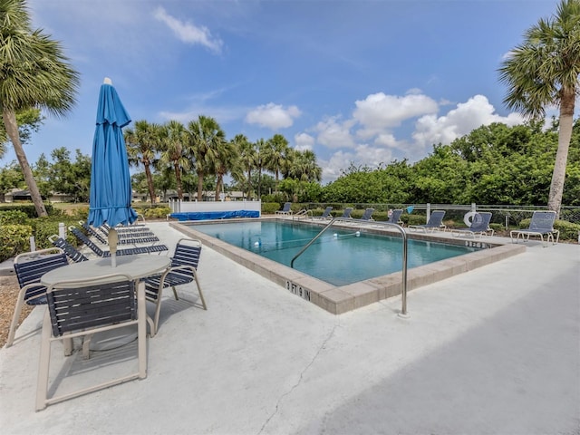232 Cerromar Way Unit 38, Venice, FL 34293 - community pool featuring a patio and fence