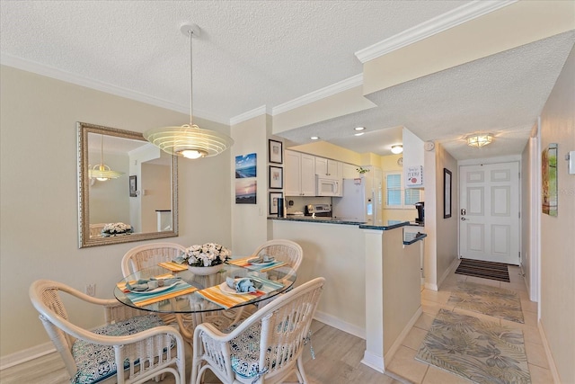950 Tarpon Center Dr Unit 504, Venice, FL 34285 - dining space featuring a textured ceiling, crown molding, and baseboards