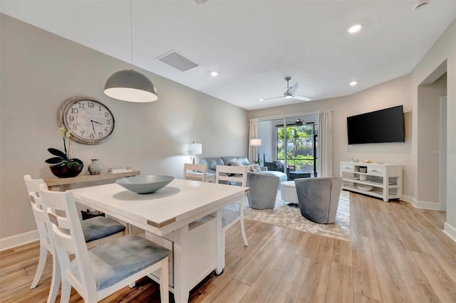 25069 Pearl Lake Cir, Englewood, FL 34223 - dining space with light wood-style flooring, baseboards, a ceiling fan, and recessed lighting