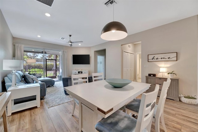 25069 Pearl Lake Cir, Englewood, FL 34223 - dining space featuring light wood finished floors and recessed lighting