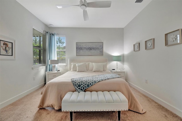 25069 Pearl Lake Cir, Englewood, FL 34223 - bedroom featuring light carpet, baseboards, and ceiling fan