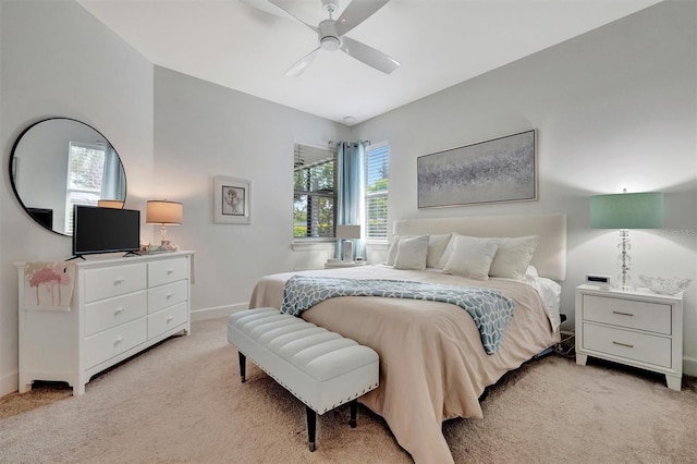 25069 Pearl Lake Cir, Englewood, FL 34223 - bedroom featuring light carpet, baseboards, and a ceiling fan