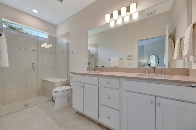 25069 Pearl Lake Cir, Englewood, FL 34223 - full bathroom with a stall shower, toilet, double vanity, and tile patterned floors