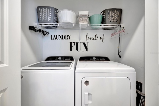 25069 Pearl Lake Cir, Englewood, FL 34223 - clothes washing area with independent washer and dryer