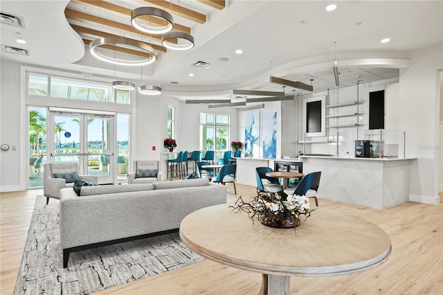 25069 Pearl Lake Cir, Englewood, FL 34223 - dining area featuring wood finished floors, baseboards, recessed lighting, a towering ceiling, and beam ceiling