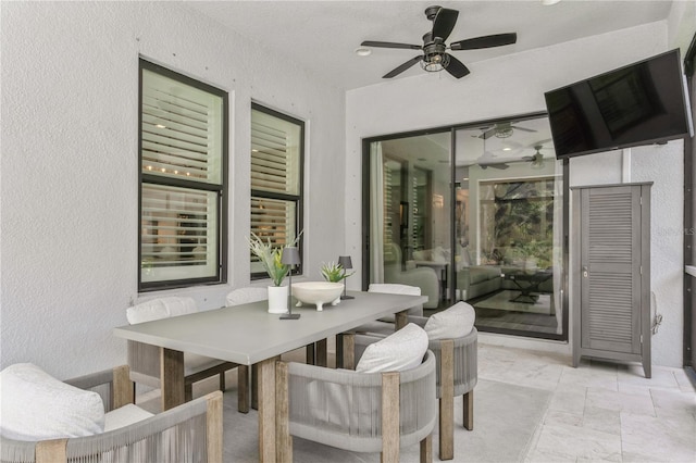 view of patio / terrace featuring a ceiling fan and outdoor dining area