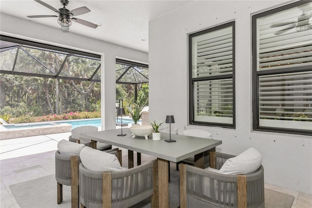 sunroom / solarium with outdoor dining area, a ceiling fan, a jacuzzi, and a swimming pool
