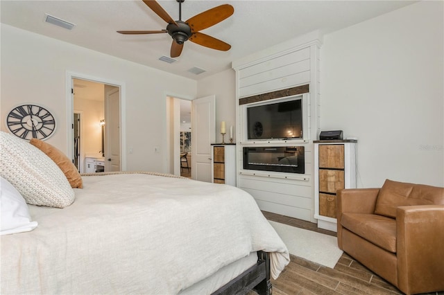 bedroom with wood finished floors and ceiling fan
