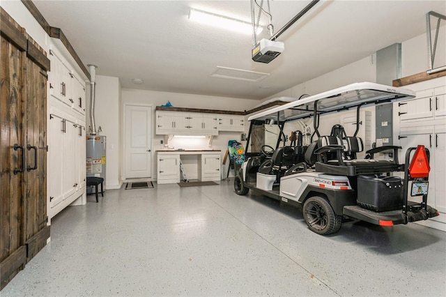 garage featuring a garage door opener and water heater