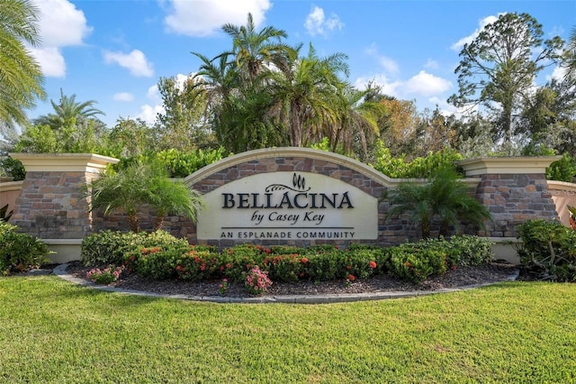 community / neighborhood sign with a yard