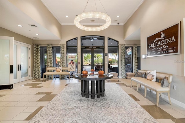 lobby with ornamental molding, recessed lighting, and a high ceiling