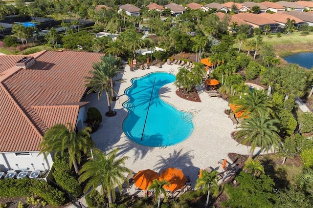 aerial perspective of suburban area featuring a pool