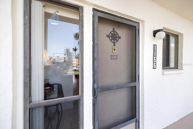 1156 Bird Bay Way Unit 104, Venice, FL 34285 - property entrance featuring stucco siding