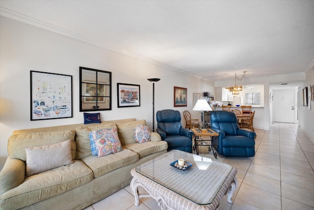 1156 Bird Bay Way Unit 104, Venice, FL 34285 - living room with a chandelier, light tile patterned floors, ornamental molding, and a textured ceiling