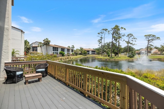 1156 Bird Bay Way Unit 104, Venice, FL 34285 - wooden terrace with a water view and a residential view