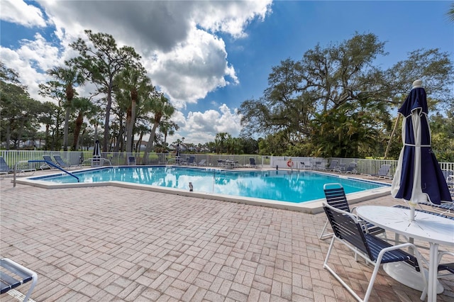 1156 Bird Bay Way Unit 104, Venice, FL 34285 - community pool featuring fence and a patio