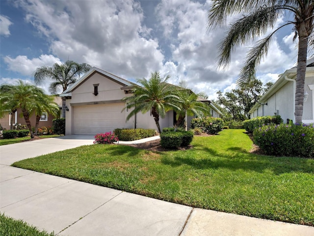 25784 Grayton Ave, Englewood, FL 34223 - view of front of house featuring driveway, stucco siding, a garage, and a front yard