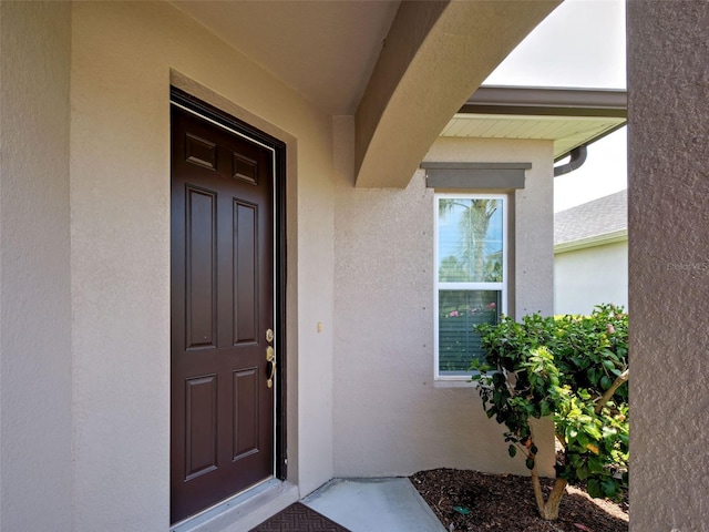 25784 Grayton Ave, Englewood, FL 34223 - entrance to property with stucco siding