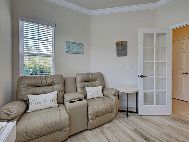 25784 Grayton Ave, Englewood, FL 34223 - sitting room featuring ornamental molding, healthy amount of natural light, light wood finished floors, and baseboards