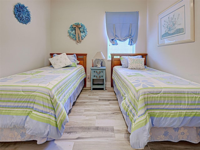 25784 Grayton Ave, Englewood, FL 34223 - bedroom with light wood-type flooring
