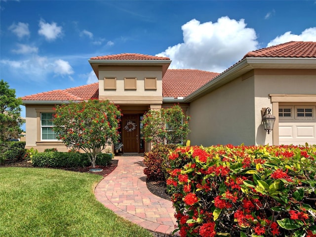 515 Sawgrass Bridge Rd, Venice, FL 34292 - view of front of property with stucco siding, a front lawn, and a tile roof