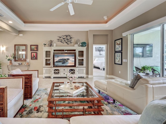 515 Sawgrass Bridge Rd, Venice, FL 34292 - living room with a tray ceiling, a ceiling fan, recessed lighting, tile patterned floors, and baseboards