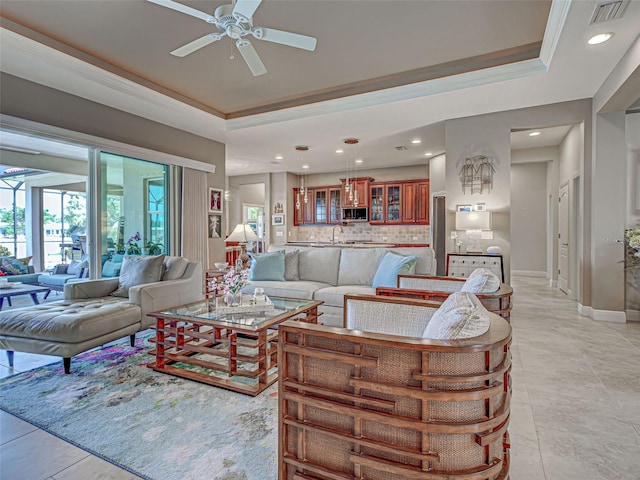 515 Sawgrass Bridge Rd, Venice, FL 34292 - living area with a tray ceiling, a ceiling fan, recessed lighting, baseboards, and light tile patterned flooring