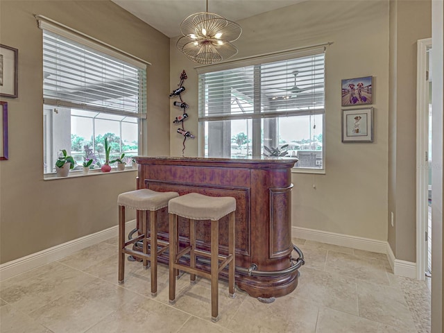 515 Sawgrass Bridge Rd, Venice, FL 34292 - indoor dry bar with plenty of natural light, baseboards, and pendant lighting