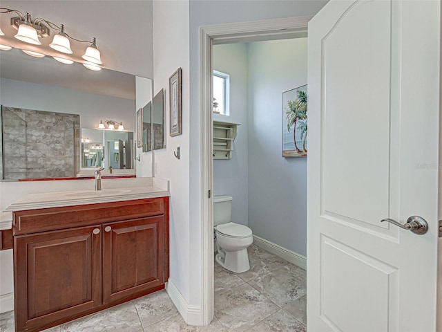 515 Sawgrass Bridge Rd, Venice, FL 34292 - bathroom with toilet, baseboards, vanity, and tile patterned flooring