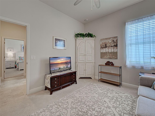 515 Sawgrass Bridge Rd, Venice, FL 34292 - living room with baseboards, a ceiling fan, and light colored carpet