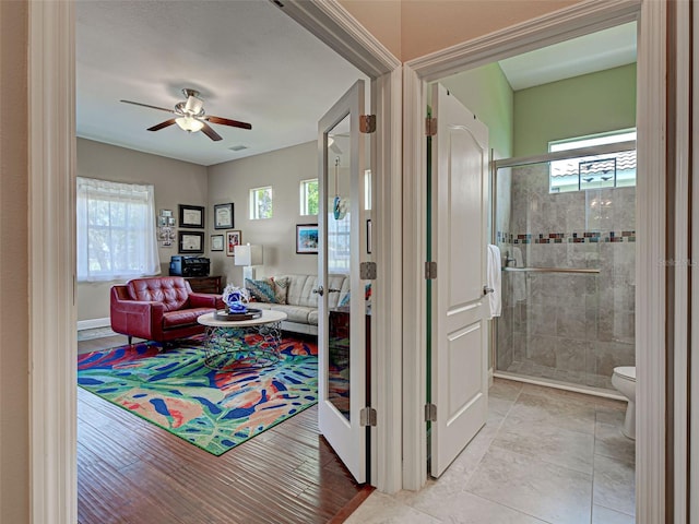 515 Sawgrass Bridge Rd, Venice, FL 34292 - living area with healthy amount of natural light and a ceiling fan