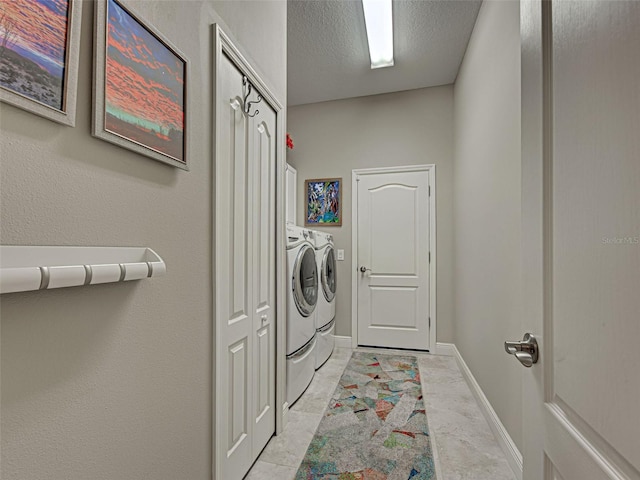515 Sawgrass Bridge Rd, Venice, FL 34292 - laundry room with washer and dryer, cabinet space, baseboards, a textured ceiling, and light marble finish floors
