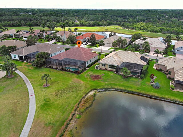 515 Sawgrass Bridge Rd, Venice, FL 34292 - aerial perspective of suburban area with a large body of water and a heavily wooded area