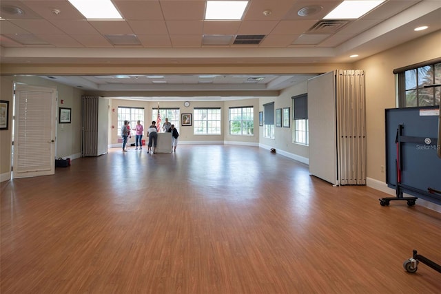 515 Sawgrass Bridge Rd, Venice, FL 34292 - exercise area with light wood finished floors, baseboards, and a paneled ceiling