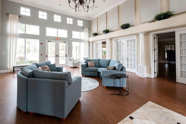 515 Sawgrass Bridge Rd, Venice, FL 34292 - living area featuring french doors, ornamental molding, a high ceiling, a chandelier, and dark wood-type flooring