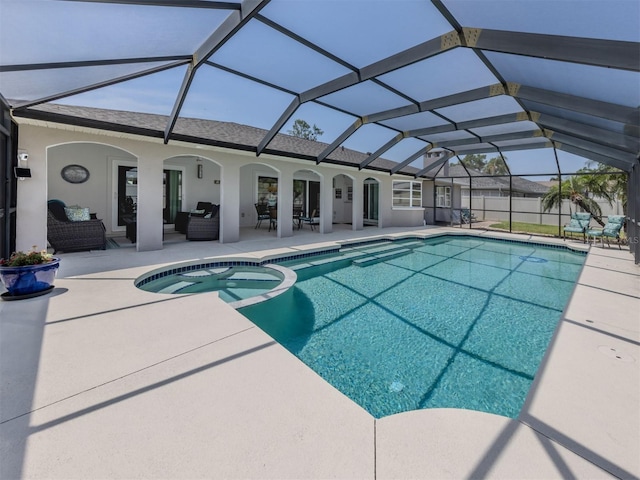 view of swimming pool with outdoor lounge area, a patio area, a pool with connected hot tub, and glass enclosure